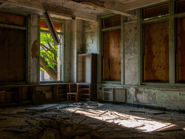 light shining into abandoned classroom