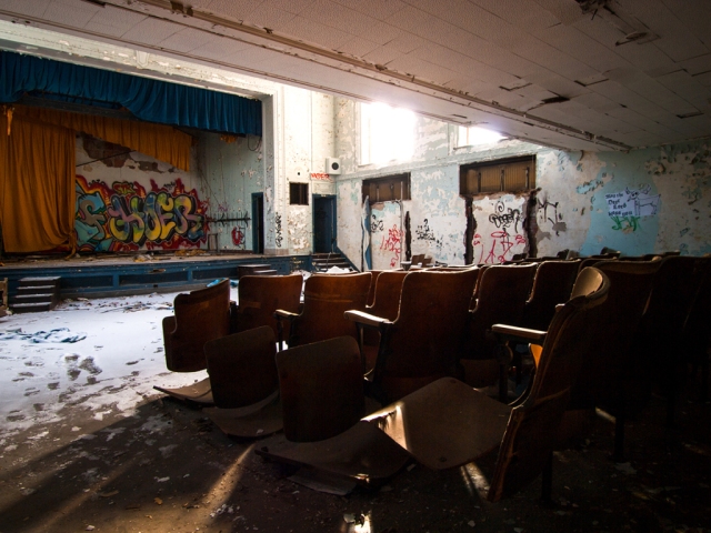 light shining into abandoned auditorium