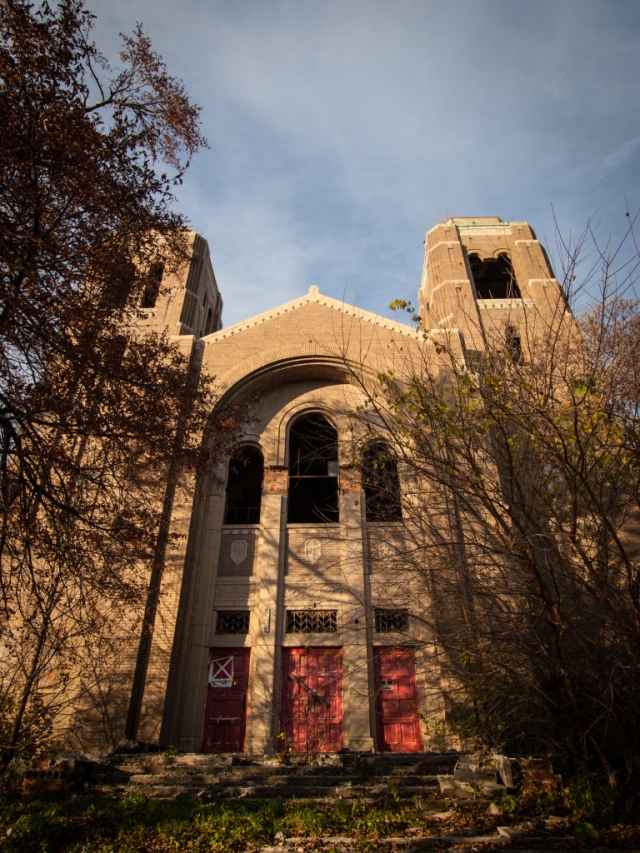 abandoned church with bell towers and red doors