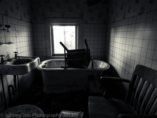 chair in bath tub in abandoned house