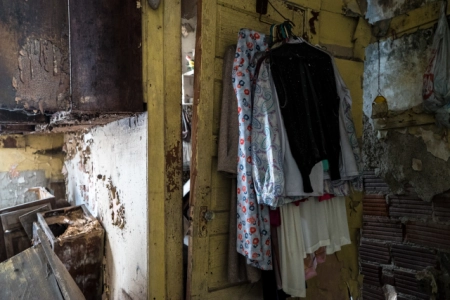 clothes hanging in abandoned home
