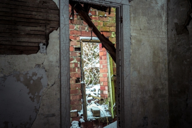 door looking through to other door in abandoned home