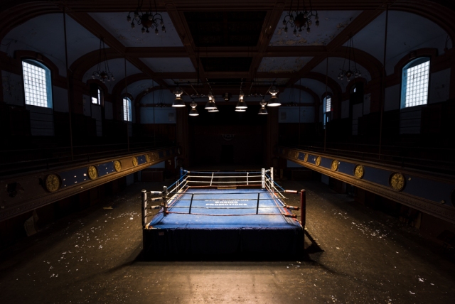 abandoned blue horizon boxing ring with light on