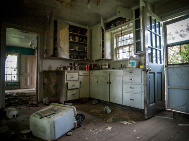 farm house kitchen inside abandoned home trash scattered everywhere