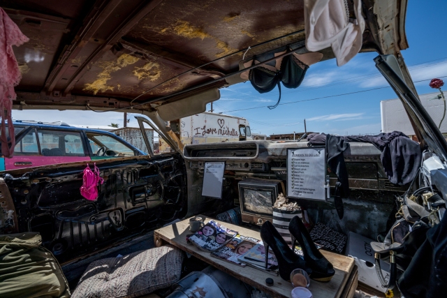 underwear bras and shoes inside car at bombay beach