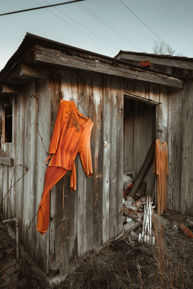 dress hanging on abandoned house